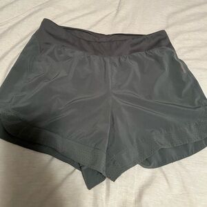 Green REI running shorts